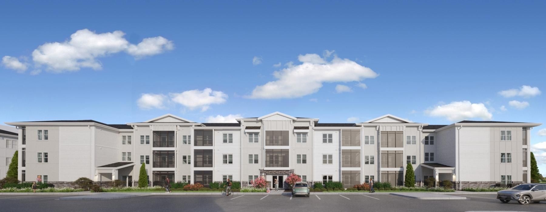 a large white building with cars parked in front of it