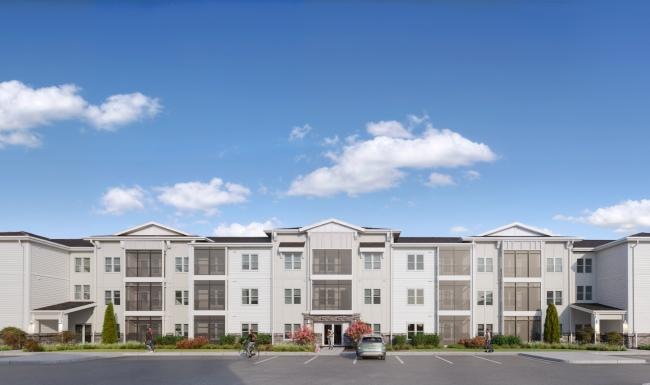a large white building with cars parked in front of it